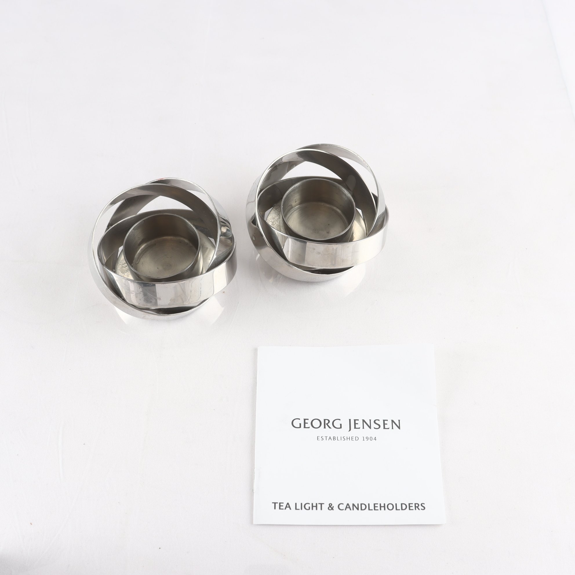 Ljuslyktor, rostfritt stål, ”Ribbon”, Georg Jensen, Danmark, 1 par