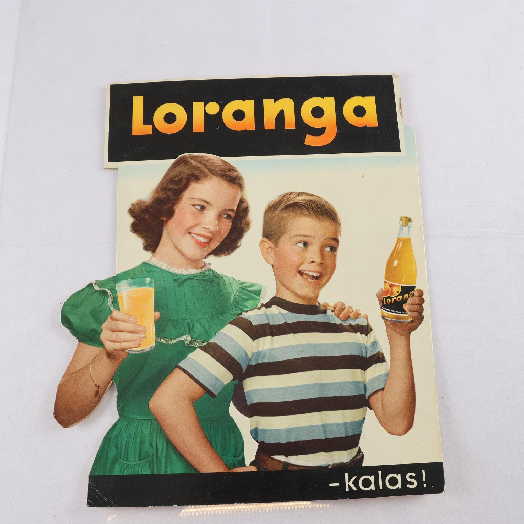 Reklamskylt, papp, Loranga, 1950-tal. Samfraktas ej.