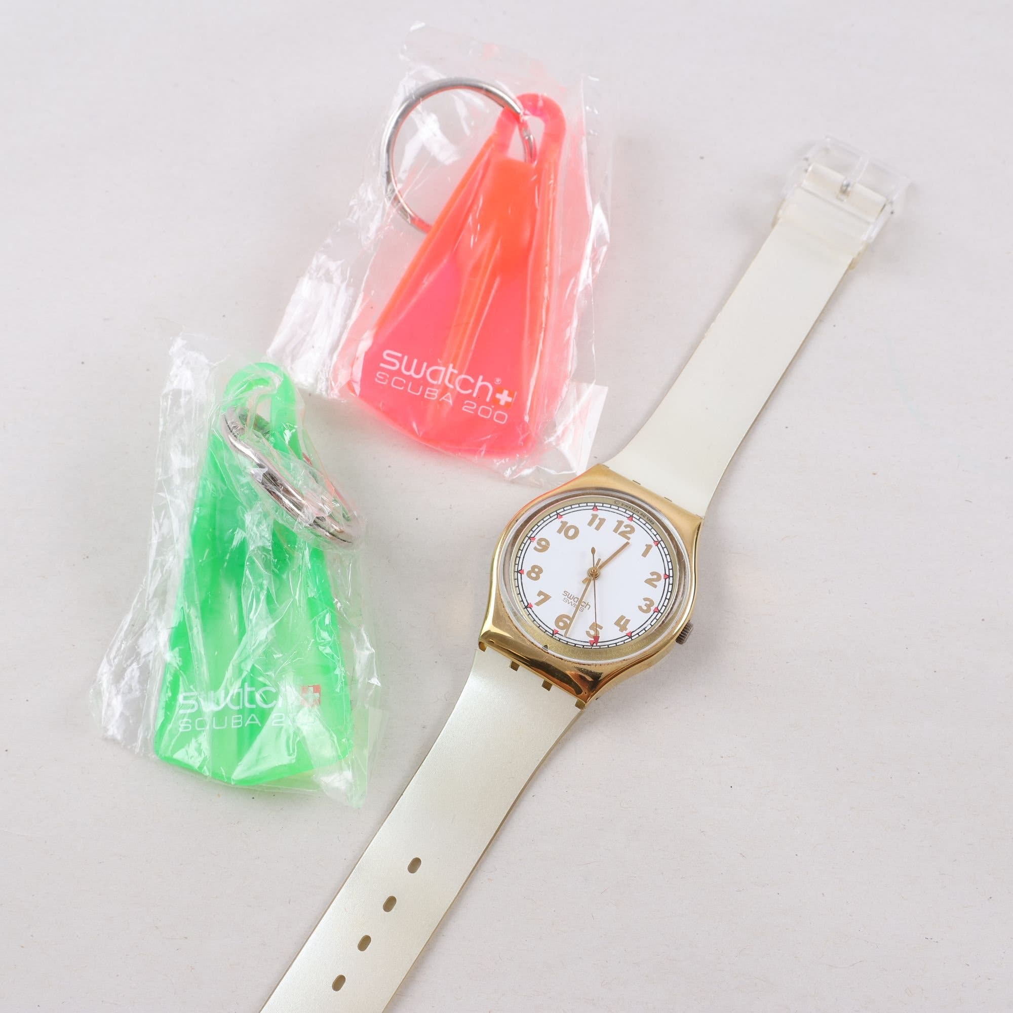 Armbandsur, Swatch, två nyckelringar