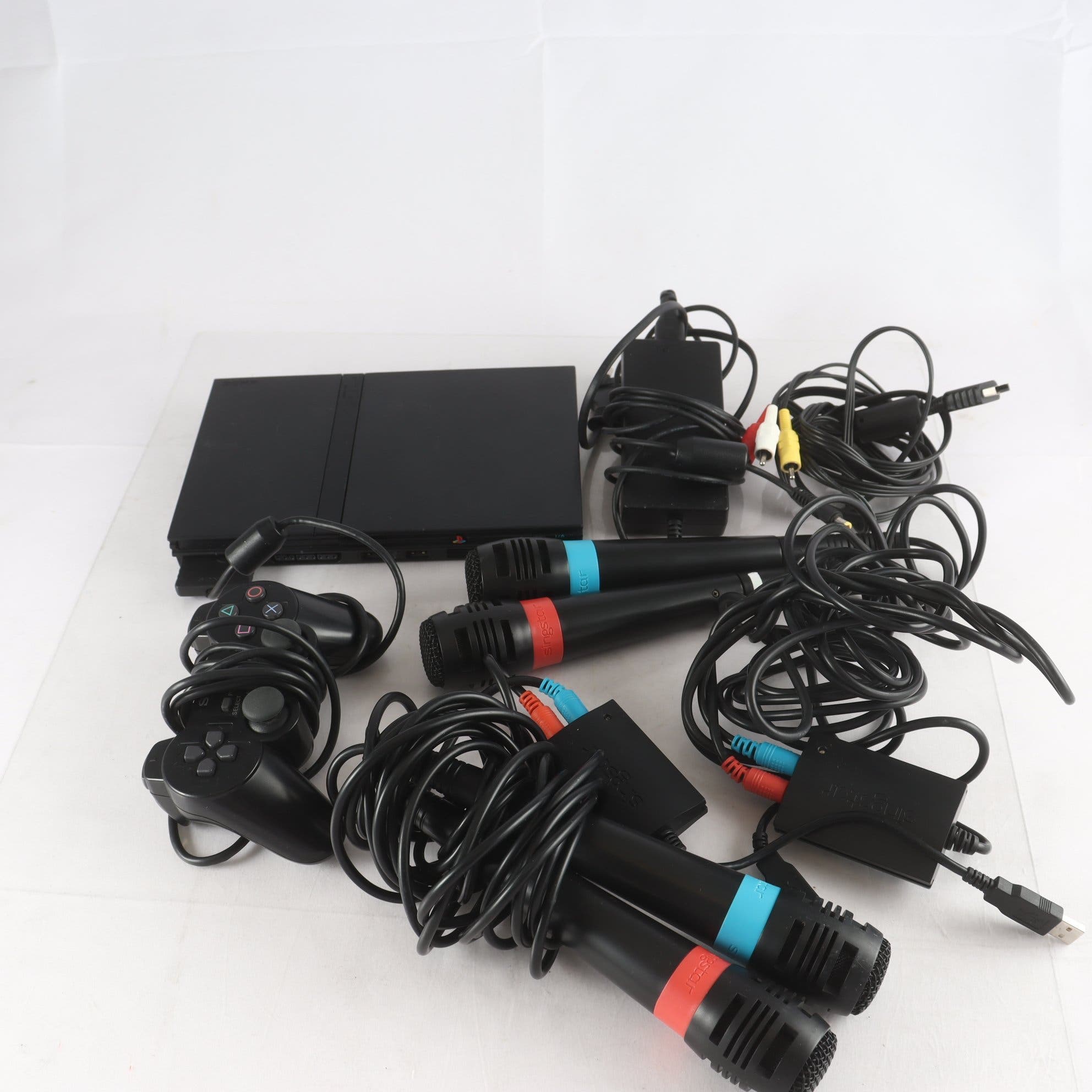 Spelkonsol, Playstaion 2, med mikrofoner. Samfraktas ej.