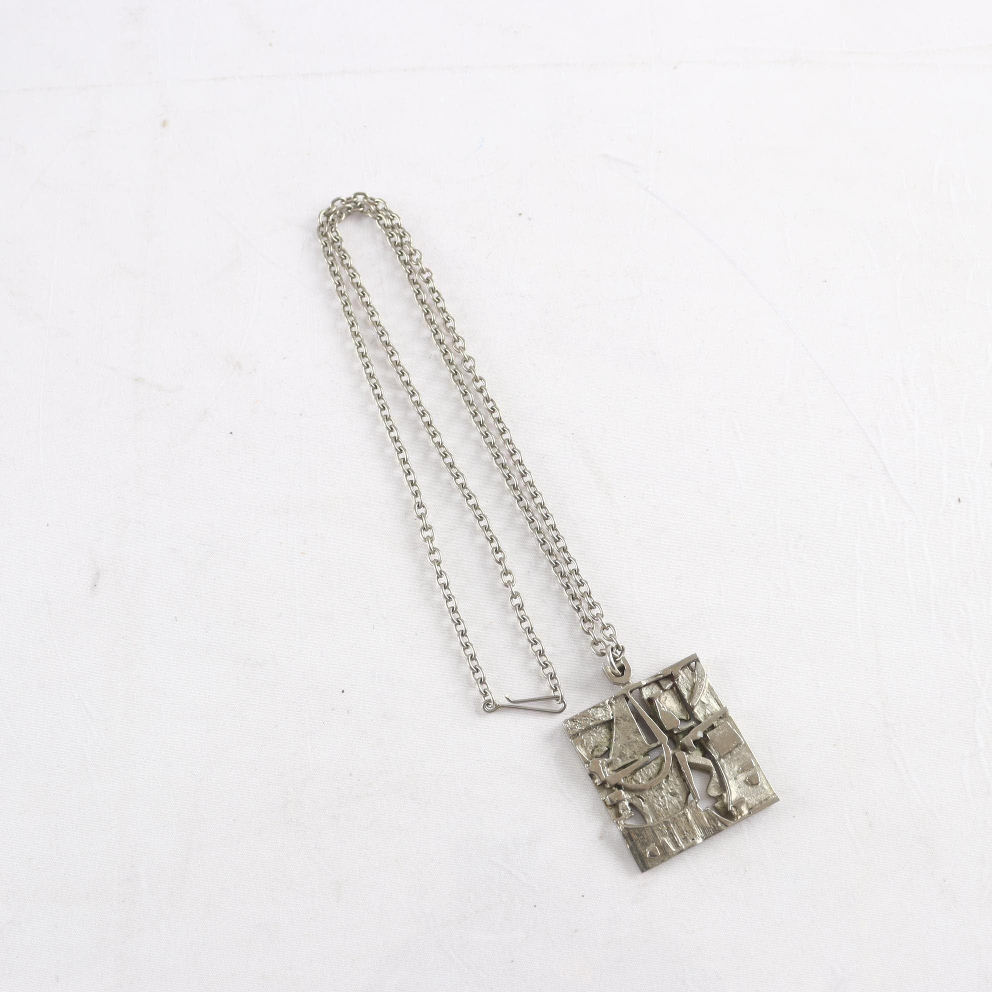 Halsband & hänge, Jorma Laine, vitmetall